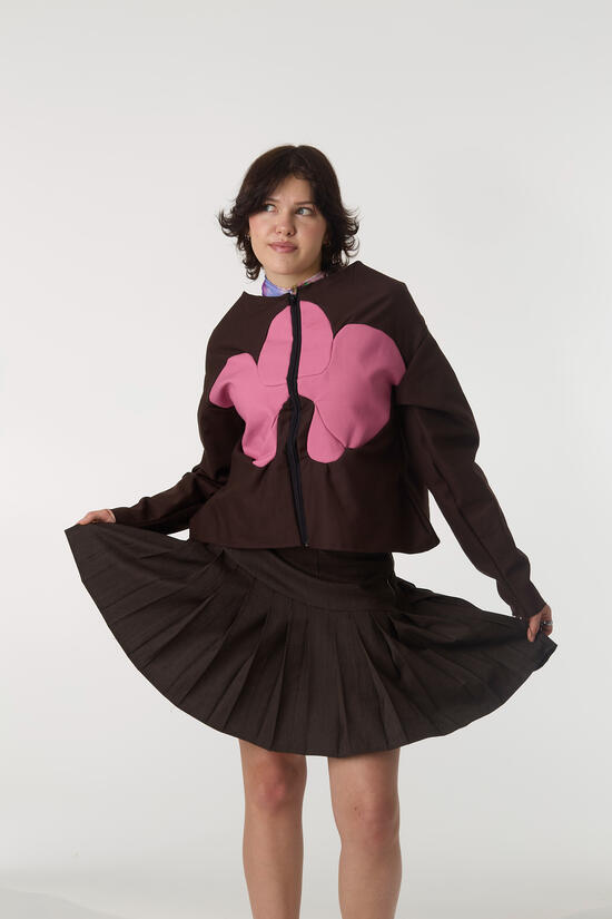 shown wool pleated skirt and FW 27 orchid jacket